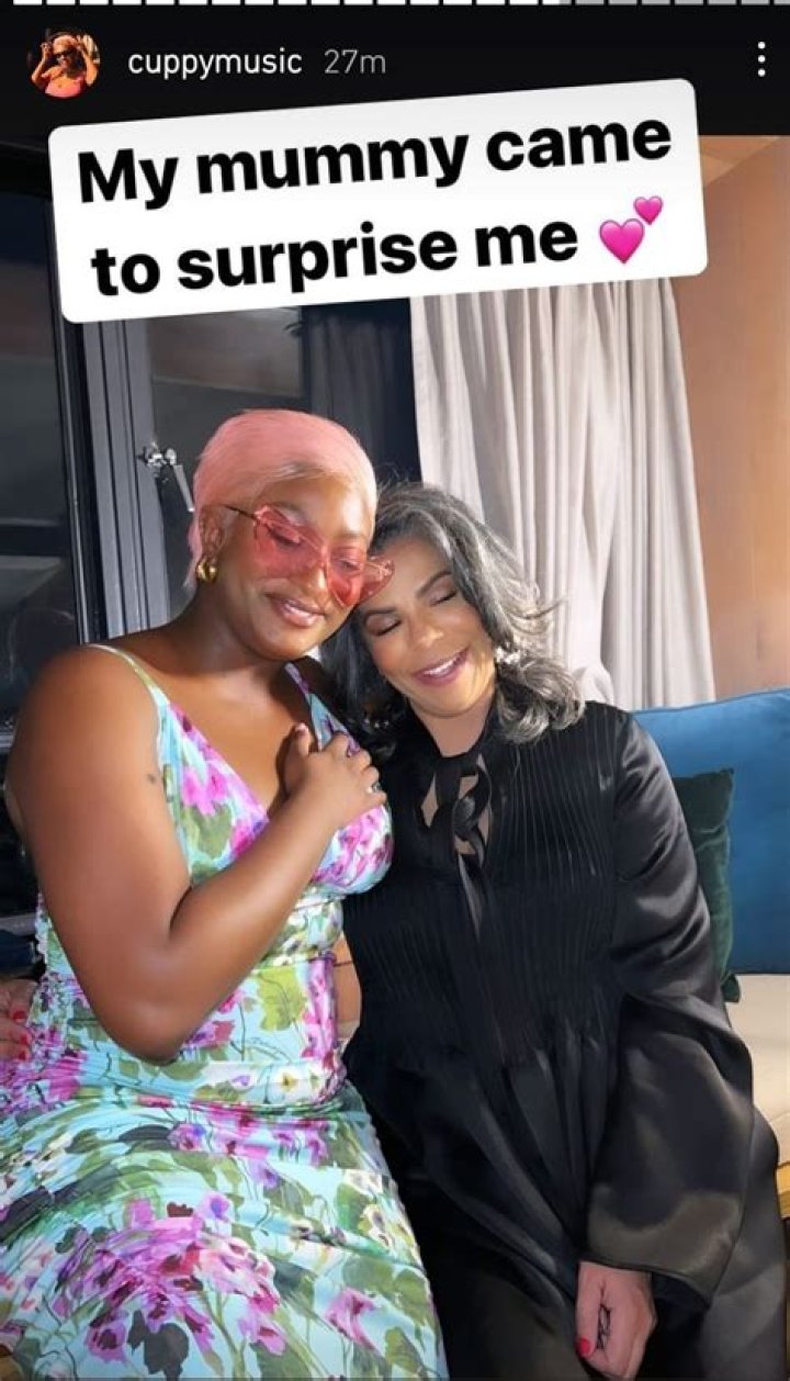 DJ Cuppy's mum, Nana Otedola covers her daughter's exposed cleavage