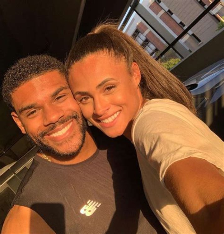Sydney McLaughlin's Parents Embrace Andre Levrone Jr.
